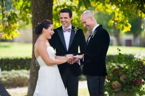 bride and groom exchanging rings at their chateau rigaud wedding near bordeaux