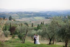bride and groom in the olives groves at cinciano wedding in tuscany photography by especially amy